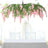 Hanging pink floral chandelier above a table in a bright room.