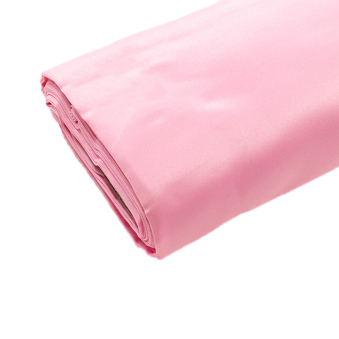 Rolled pink satin fabric on a white background