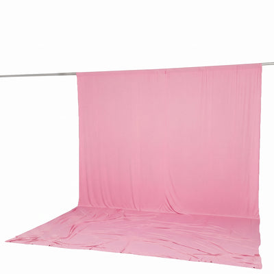 Pink photo backdrop curtain on stand with seamless floor spillover
