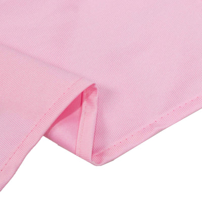 Pink ribbed cotton fabric close-up with folded hem detail