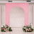 Pink arch backdrop with floral arrangements for events or photography.