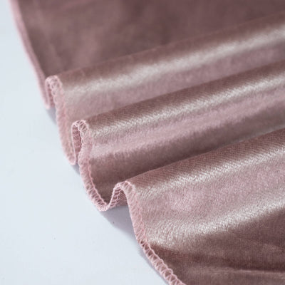 Pink velvet fabric with soft ruffled edges and subtle sheen