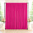 Pink wedding backdrop curtain with floral arrangements and candles