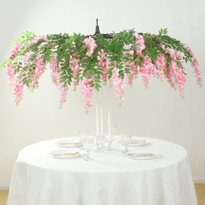 Artificial pink floral chandelier for elegant dining decor.