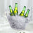 Clear ice bucket with bottles, perfect for parties and gatherings.