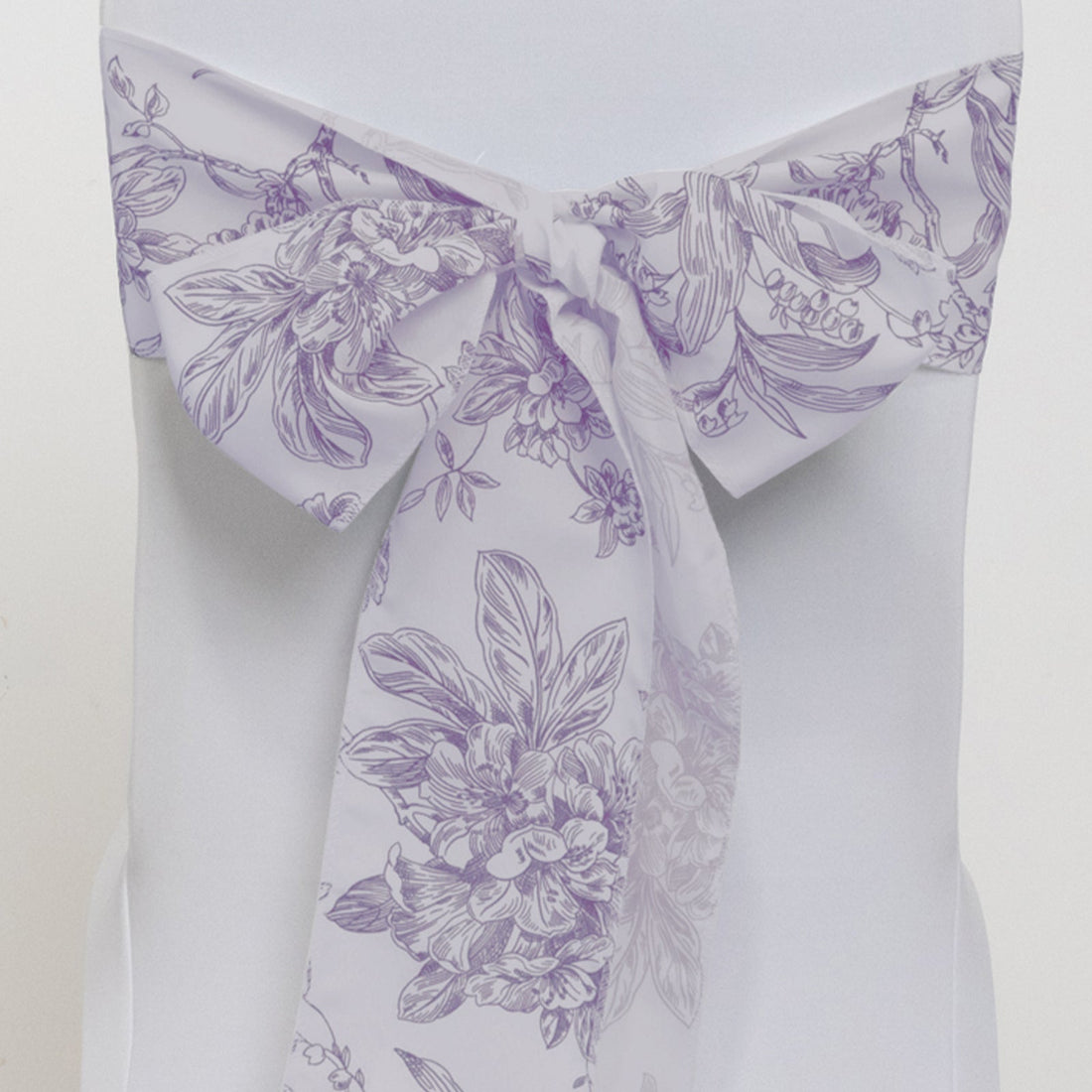 Purple floral chair sash on a white chair. #whtbkgd