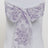 Purple floral chair sash on a white chair. #whtbkgd