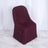 Burgundy chair cover on a plain backdrop