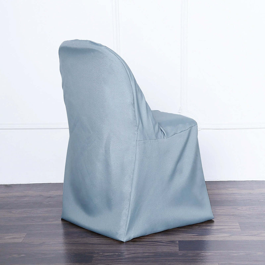Gray slipcovered chair with a modern design.