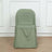 Green chair cover on a plain chair against a light background