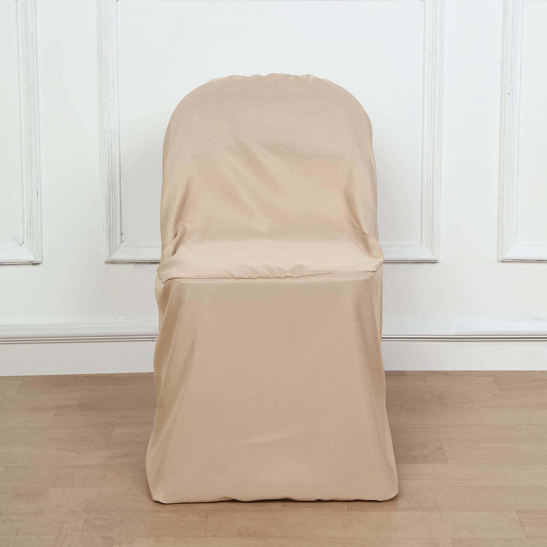 Beige stretch chair cover on a plain background.