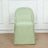 Green chair cover on a plain chair against a light backdrop.