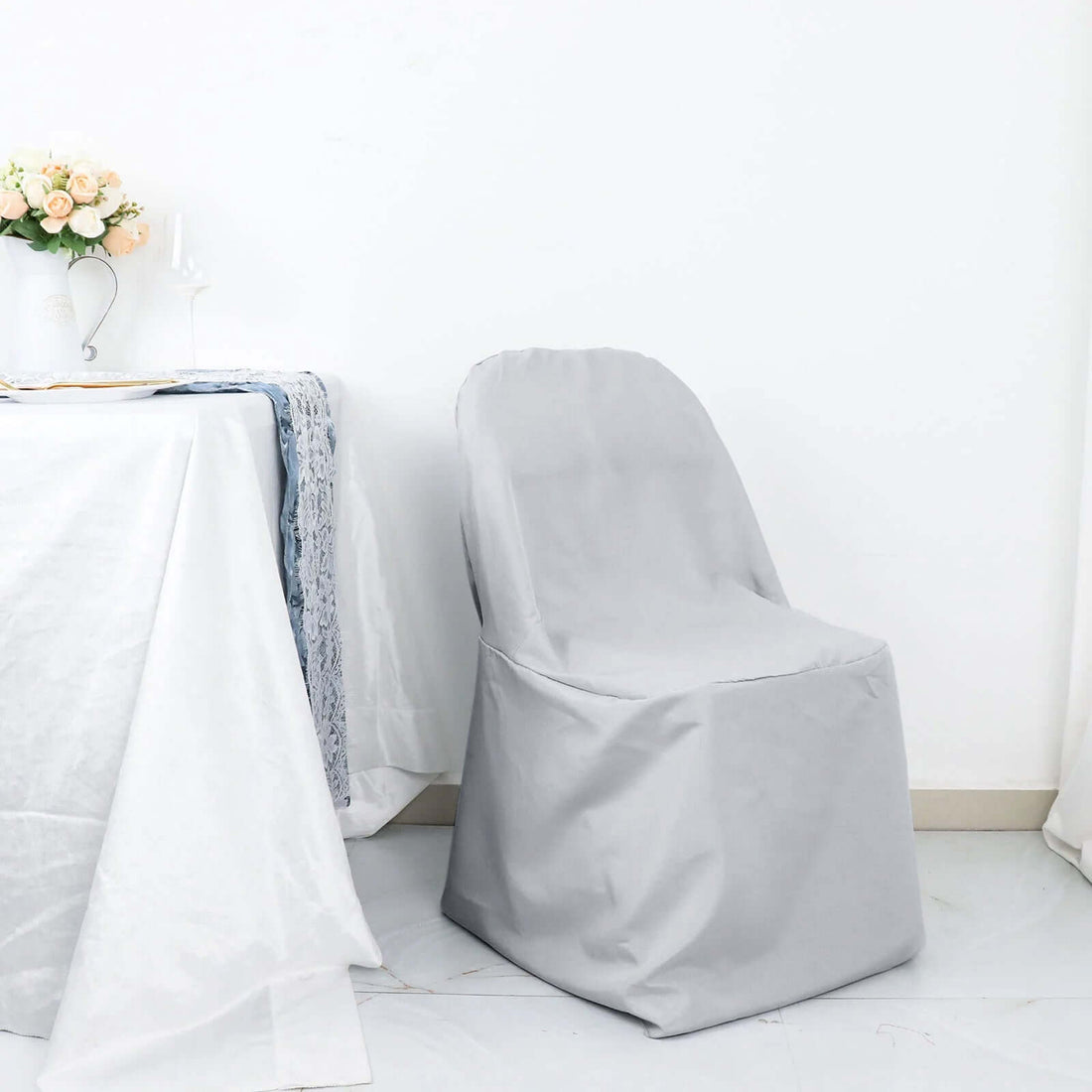 Gray chair cover on a plain background, designed for elegant dining setups.