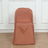 Brown chair cover on a plain chair against a light background.
