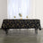 Elegant black tablecloth with gold geometric patterns on a styled table setting.