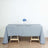 Elegant grey tablecloth draped over a wooden table with a floral centerpiece.