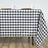 Black and white checkered tablecloth draped on a table.