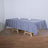 Blue and white checkered tablecloth on a wooden table.