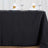 Black tablecloth with decorative duck napkins and wine glasses.