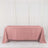 Pink tablecloth draped over a table in a studio setting