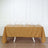Brown tablecloth draped over a table set with plates and glasses.