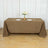 Brown tablecloth draping over a table set with plates and glasses.