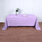Lavender tablecloth on a wooden table with a vase and plate