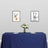 Decorative wall art featuring deer illustrations above a table setting.