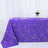 Purple tablecloth with gold geometric pattern on a white table