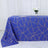Blue geometric tablecloth with gold accents on a white backdrop.