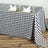 Black and white checkered tablecloth on a wooden table.