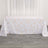 White tablecloth with gold geometric design on a wooden floor.