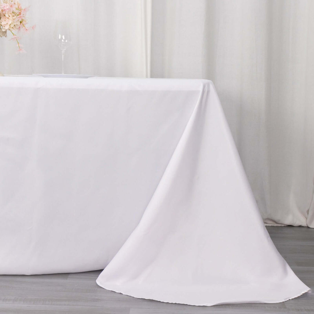 White tablecloth draped elegantly over a table.