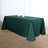 Green tablecloth draped over a table with two white dishes on top.