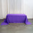 Purple tablecloth on a wooden floor with sheer curtains in the background.