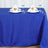 Blue tablecloth with elegant napkin folds and dining setup.