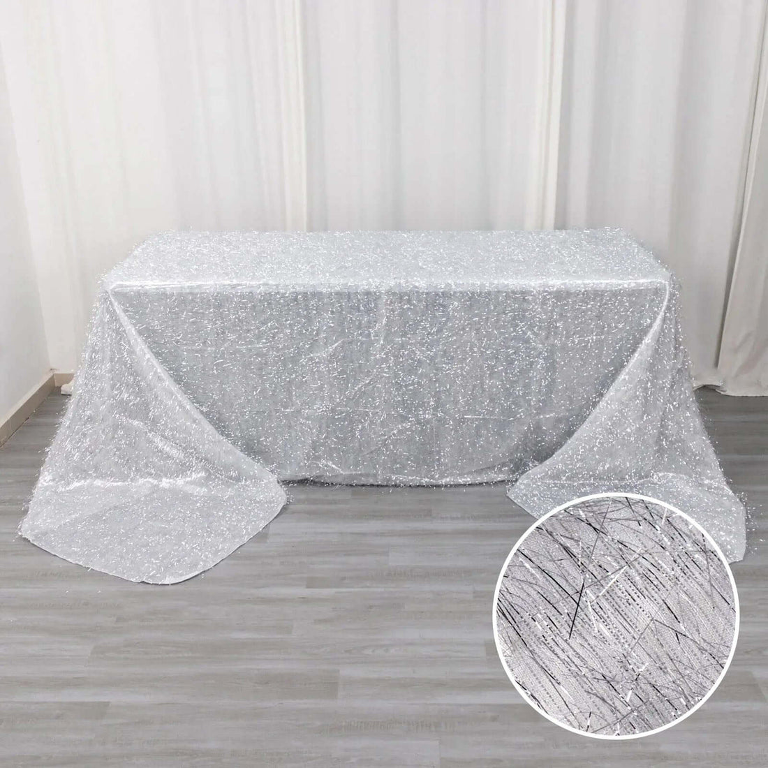 Silver sequin tablecloth draped elegantly over a table.