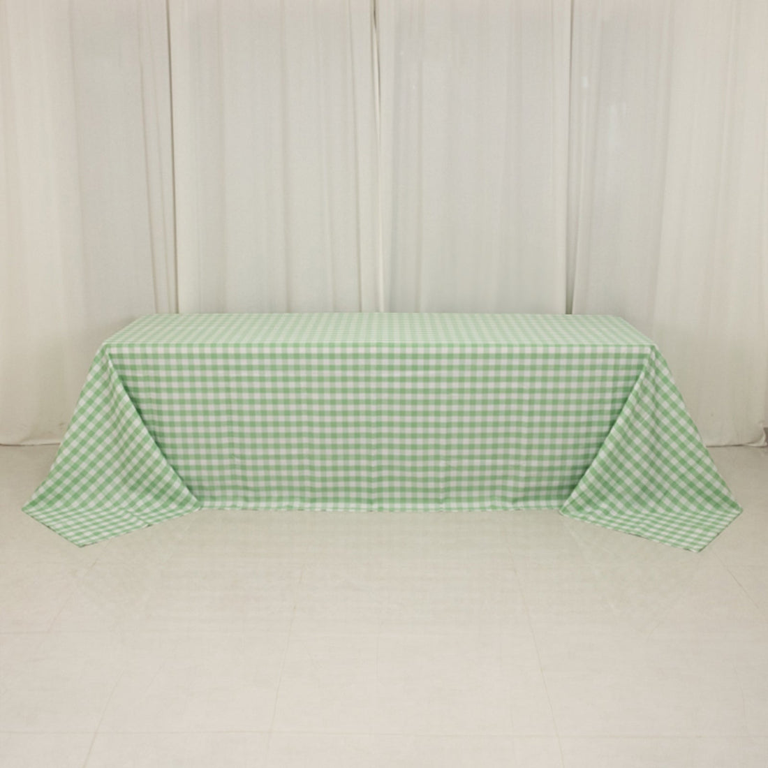 Green checkered tablecloth draped over a table.
