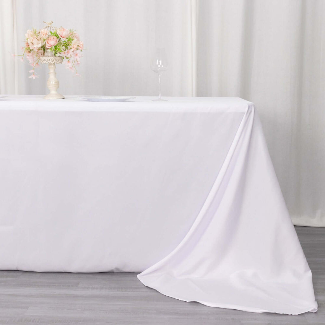 Elegant white tablecloth draped on a table for events or dining decor.