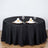 Elegant black tablecloth set for dining with decorative napkin presentation.