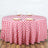 Red and white checkered tablecloth on a round table with place settings.