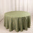 Round green tablecloth with golden leaf pattern on plain backdrop.