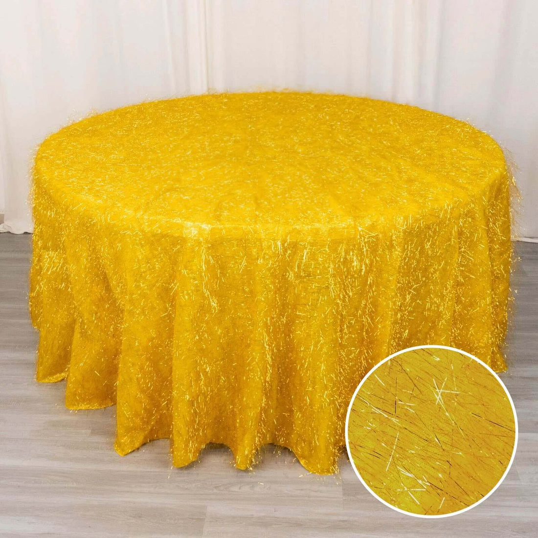 Yellow shimmer tablecloth with fringed texture, perfect for events.