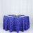 Blue tablecloth with gold geometric pattern on a round table.