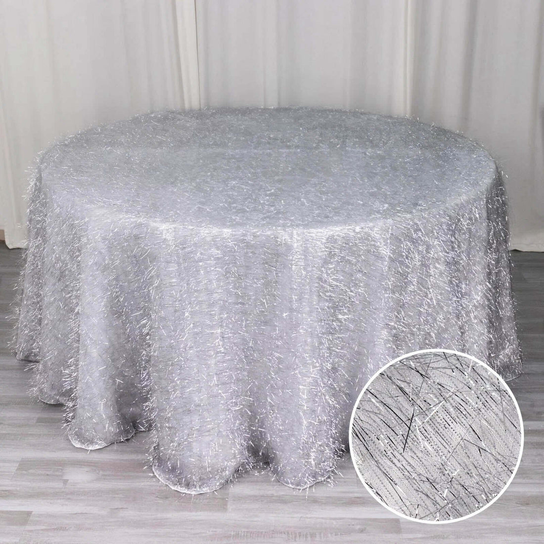 Silver sheer tablecloth with textured finish, featuring a round shape.