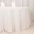 White tablecloth with fluffy texture draping over a table.
