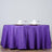 Purple tablecloth draped elegantly over a table with decorative napkins and glasses.