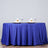 Elegant blue table setting with wine glasses and decorative napkins.