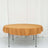 Round table covered with a mustard yellow tablecloth