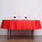 Elegant red table setting with wine glasses and flower-adorned napkins.